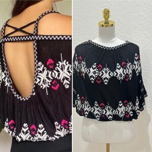 Free People black embroidered cold-shoulder crop top.